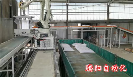腻子粉自动装车机器人在企业代替人工装车
